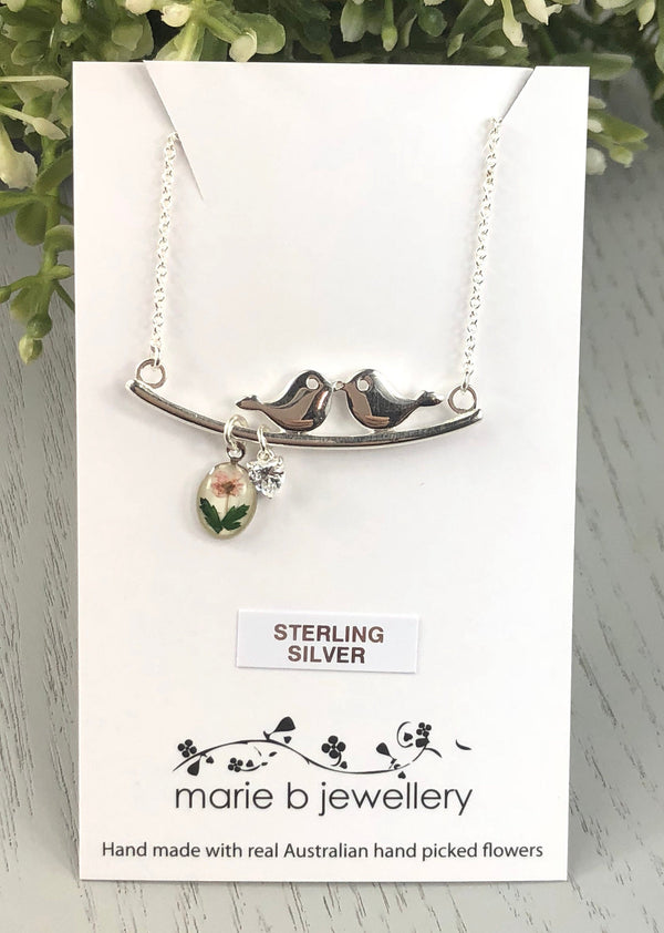 Love bird necklace with a pressed flower charm